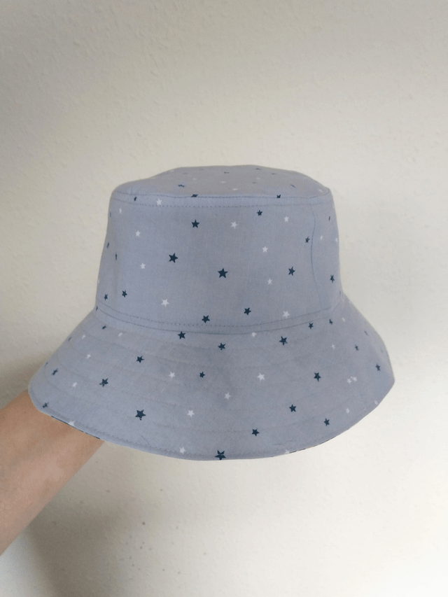 Hat - approx 5-8 yrs.   Trucks and surfboards
